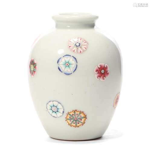 A WHITE-GLAZED FLORAL JAR