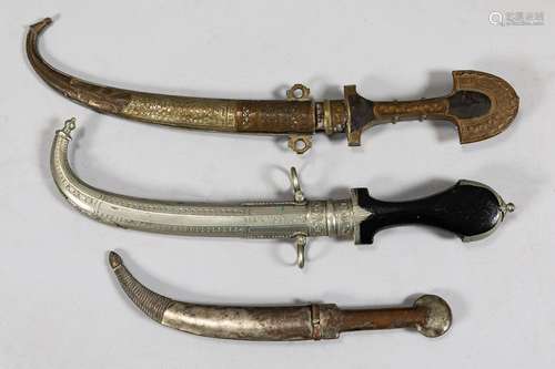 Three oriental daggers