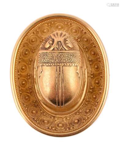 A mid 19th century historical revival gold brooch