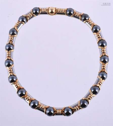 A steel, hematite and gold coloured collar necklace by Bulga...