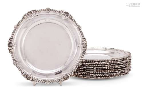 A matched set of twelve Victorian silver shaped circular din...