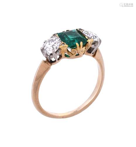 An early 20th century emerald and diamond three stone ring