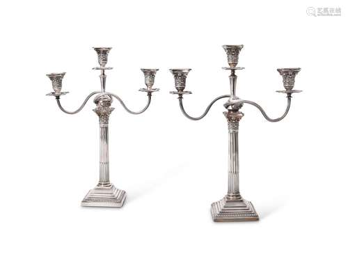 A pair of late Victorian silver three light Corinthian colum...