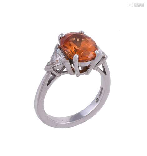 A three stone spessartine garnet and diamond ring by Theo Fe...