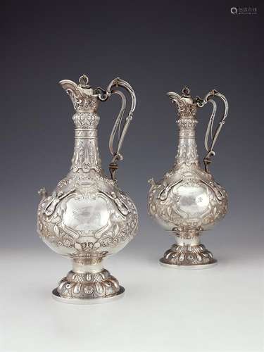 A pair of Victorian Irish silver Armada pattern claret jugs ...