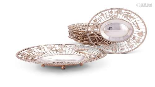 A suite of seven Victorian silver oval bread or grape basket...