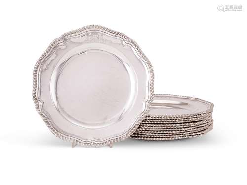 A set of twelve late George II silver shaped circular dinner...