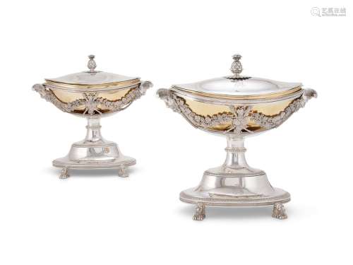 A pair of French silver parcel gilt navette pedestal sauce t...