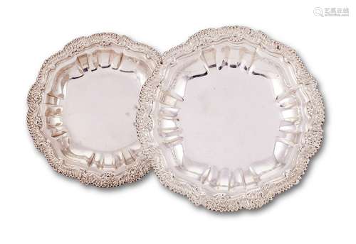 A pair of late George III silver shaped circular course dish...