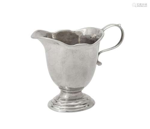 A George I cast silver helmet shaped cream jug by Pézé Pille...