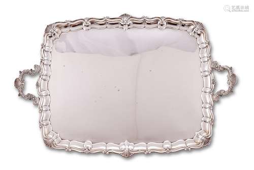 An Edwardian silver shaped rectangular twin handled tray by ...