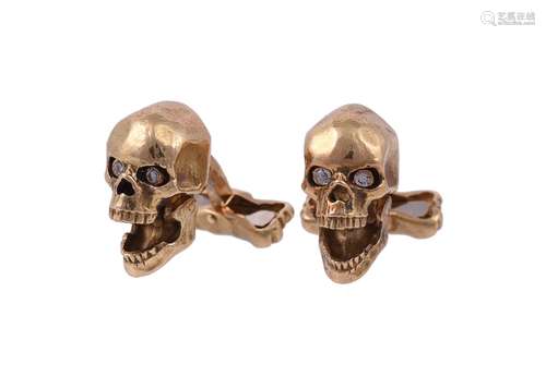 A pair of diamond set skull cufflinks by William & Son