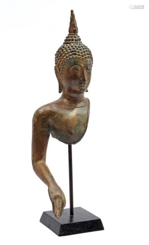 Metal head and arm of a Buddha