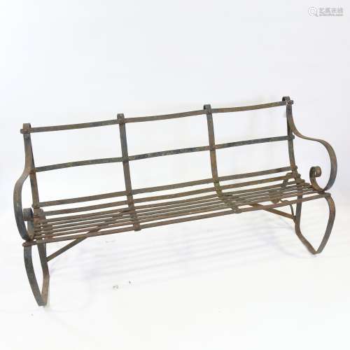 A Victorian wrought-iron 3-seat garden bench with triple-cur...