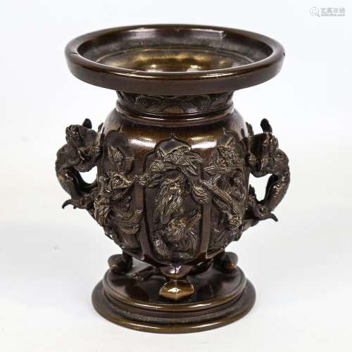 A Chinese patinated bronze urn, circa 1900, high relief cast...