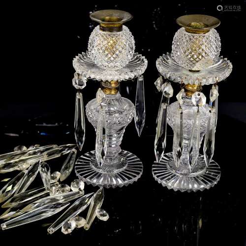 A pair of cut-glass candleholders with glass lustre drops, h...