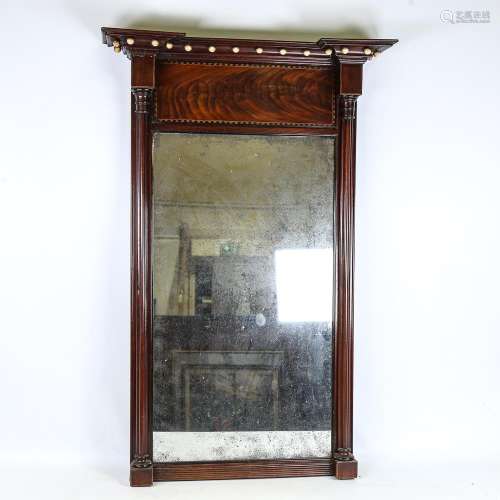 A mahogany, Regency silver backed mirror with column support...