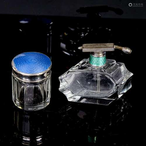 An Art Deco cut-glass perfume bottle with nickel and enamel ...