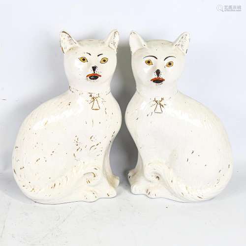 A rare pair of 19th century Staffordshire Pottery seated cat...