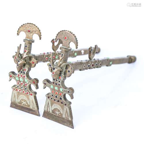 A pair of South American brass ceremonial axes, with inset c...