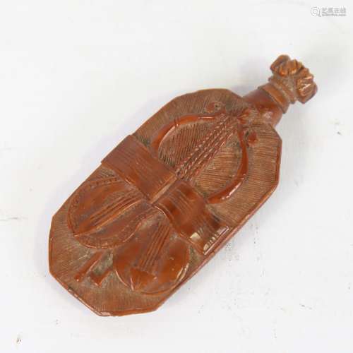 An 18th century coquilla nut snuff bottle, relief carved all...