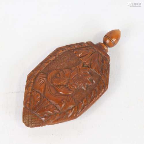 An 18th century coquilla nut snuff bottle, relief carved por...