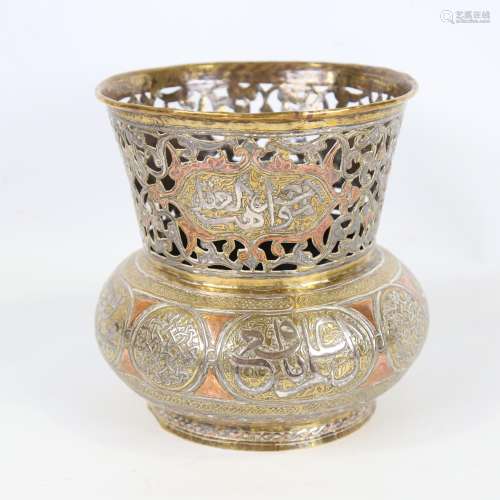 An Islamic copper and brass jardiniere, circa 1900, with sil...