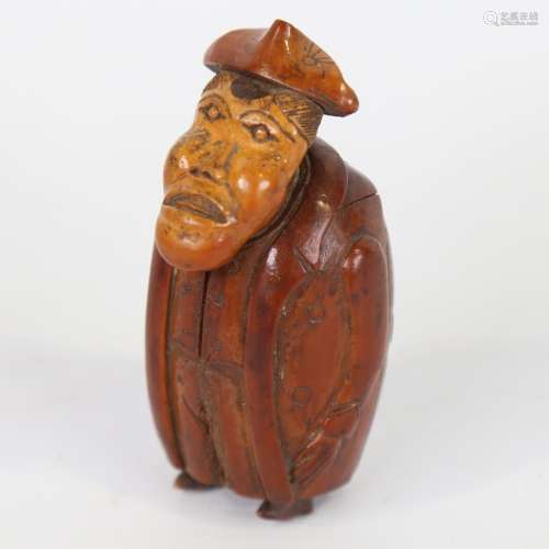 An 18th century coquilla nut snuffbox, in the form of a man ...