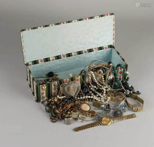 Box with various jewelry, including a Seiko watch,