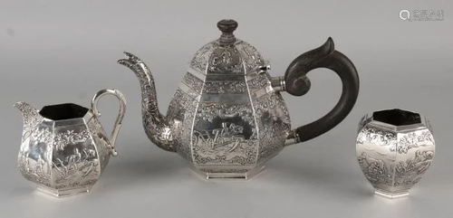 Three-piece 835/000 silver tea set with various