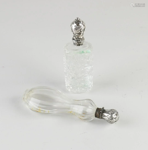 Two crystal odor bottles with a silver collar and cap,