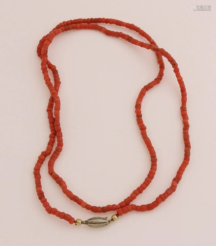 Long necklace of red corals with gold on silver oval