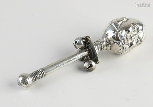 Plated rod rattle with Buddha head and 3 bells. With