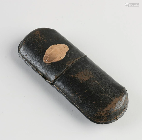 Leather glasses case with yellow gold element decorated