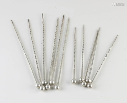 Eleven round twisted 800/000 silver skewers with ball