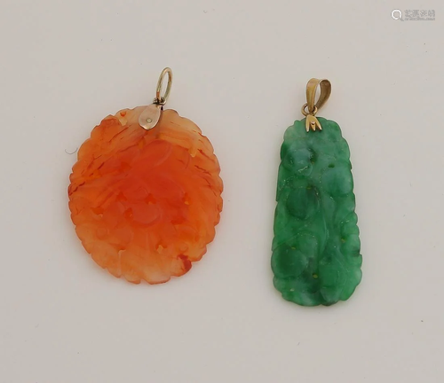 Two carved jade pendants with yellow gold pendant eye.