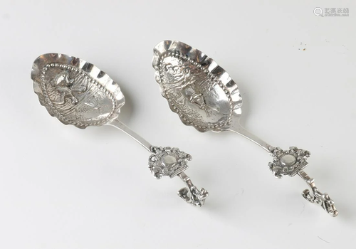 Two antique 835/000 silver cream spoons with scalloped