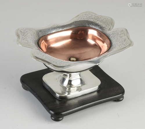 Silver pipe stove, 833/000, on wooden base with copper