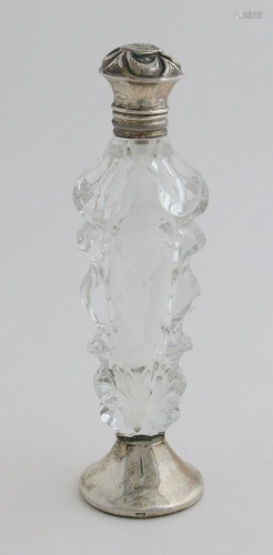 Crystal loderein bottle, contour cut, placed on a round