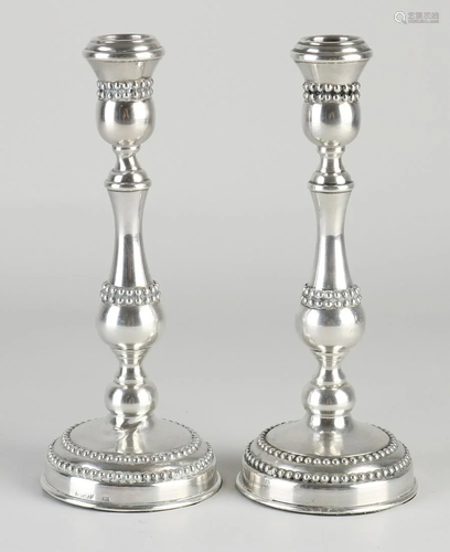 Pair of silver table candlesticks, 925/000, on a round