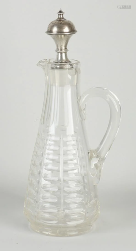 Almond-cut decanter with silver stopper. 19th century.