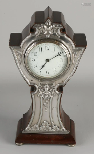 Contoured table clock with silver overlaid element on