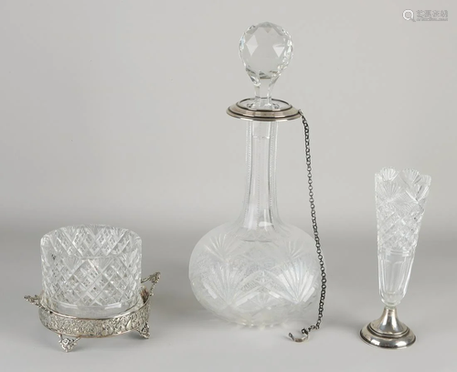 Three pieces of crystal with silver, a decanter with