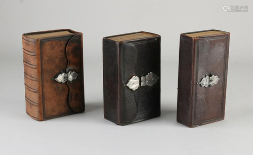 Three bibles with silver clasp, 833/000. The New