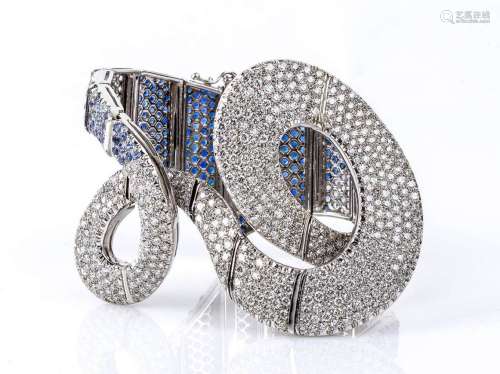 Gold ribbon bracelet with diamonds and blue sapphires pavé 1...