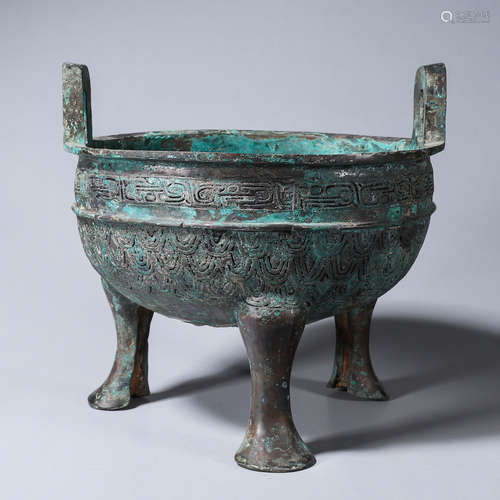 A double-eared three-legged bronze pot