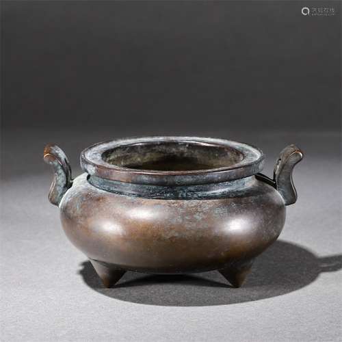 A double-eared three-legged copper censer