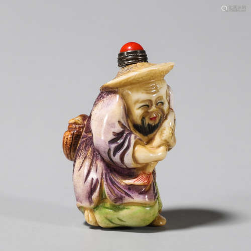 A painted figure shaped antler snuff bottle