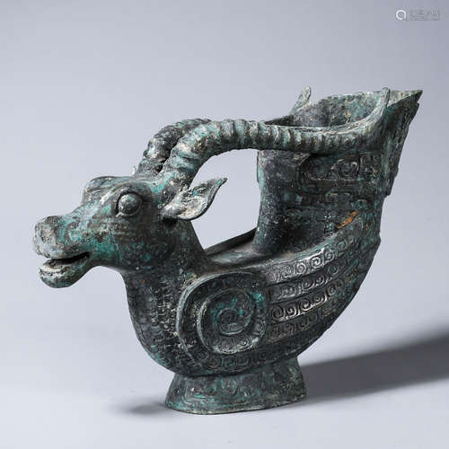 A bronze goat head cup