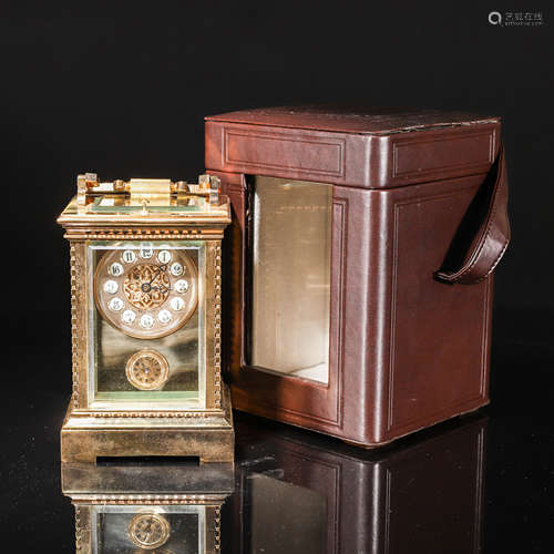 A gilt copper mechanical hanging clock